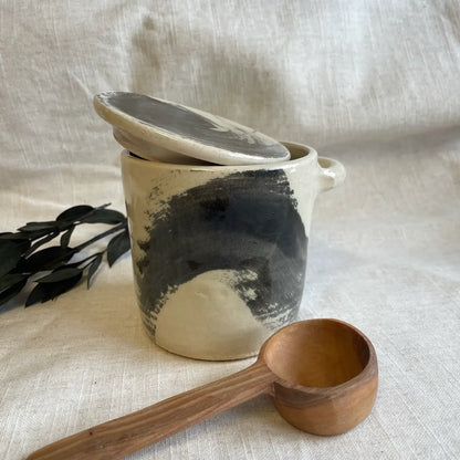 Ceramic canister with wooden spoon