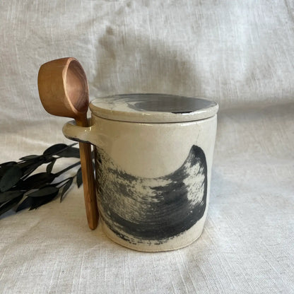 Ceramic canister with wooden spoon