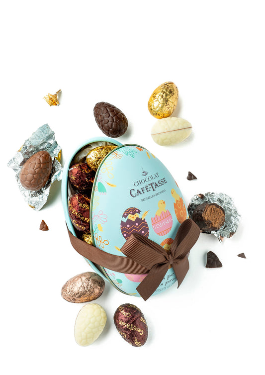 Metal egg, 12 assorted praline chocolate eggs