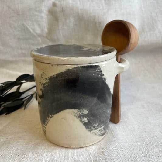 Ceramic canister with wooden spoon