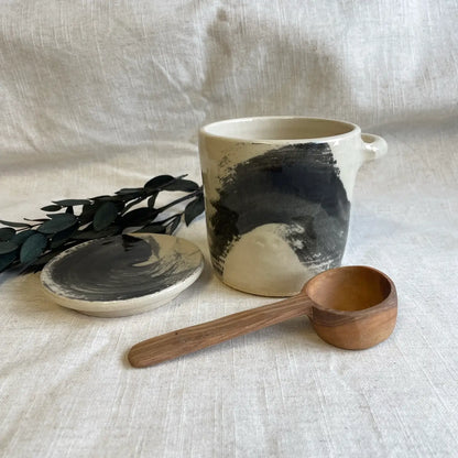 Ceramic canister with wooden spoon